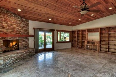 Master bedroom with stone fireplace