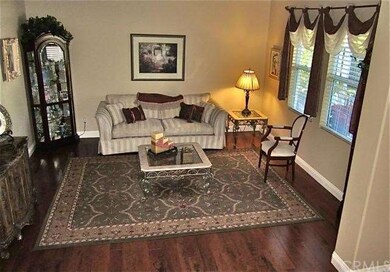 Formal living room with hardwood flooring