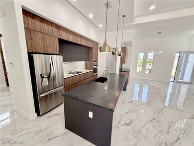 Kitchen with stainless steel appliances, modern ca