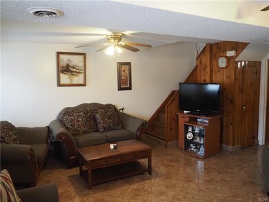 Front living room with tile floor.
