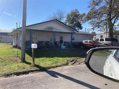 Bungalow-style house featuring a front lawn and covered porch