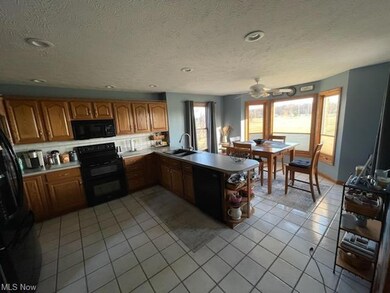 Bright and Airy Kitchen with Wood Cabinets.