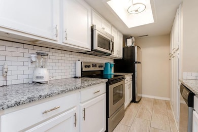 Kitchen featuring appliances with stainless steel 