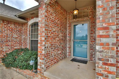 Front Porch with Newly painted front door.
