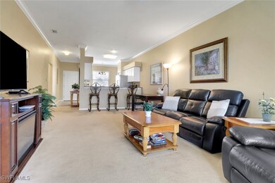 Living area featuring crown molding, light carpet,