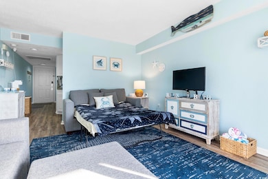 Bedroom with dark wood-type flooring