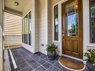 Greet guests at the double panel wood door with le