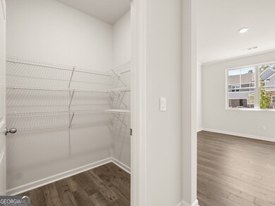 halton kitchen pantry with wire shelves off the butlers pantry leading to the flex room