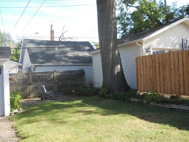 Stone patio at back of yard.