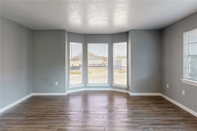 Unfurnished room featuring a textured ceiling and