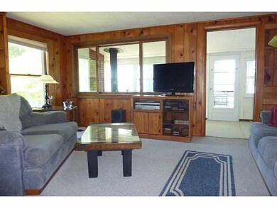 Other Living Room Opening To Three Season Porch an