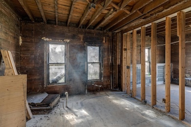 Kitchen area, with a newer wall separating the front room.