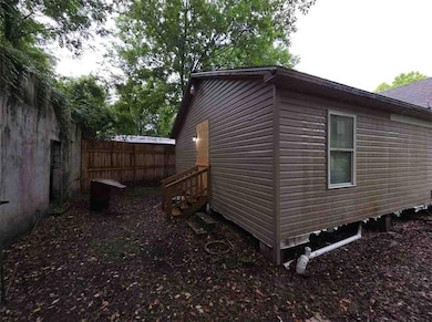 View of side of property with entry steps