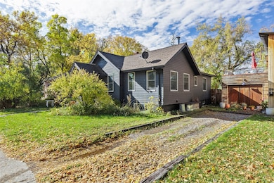 View of property exterior featuring roof with shingles