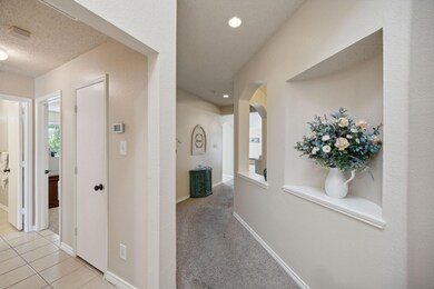 Just inside to the left are bedrooms and you conti