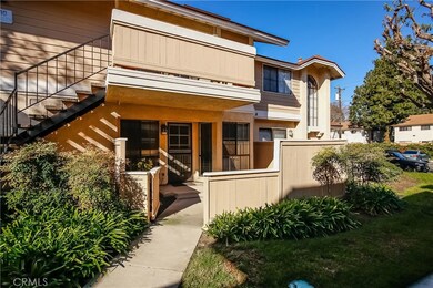 Spacious patio with flower beds and lawn right outside.