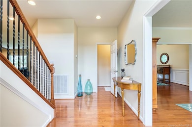 Foyer with high ceilings and plenty of light.