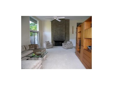The great room features a fireplace and has a door