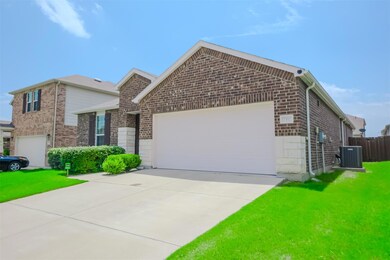 View of front of house featuring central AC