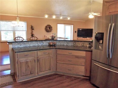 Kitchen peninsula overlooking dining & family room