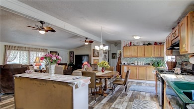 Newer vinyl flooring throughout the KT/DR/LR area