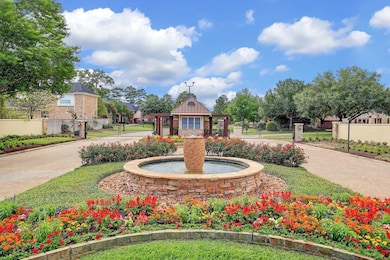 The entrance to the exclusive gated area of Coles Crossing is 1.3 miles from the Northwest Freeway, offering quick  and easy access to the corridor. Enjoy the amazing amenities of this wooded master-planned community.