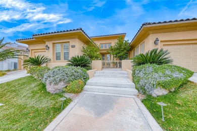 View of front facade with a garage, a front lawn,
