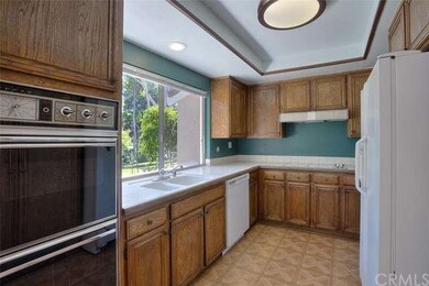 Kitchen area with lots of cabinetry and view to gr
