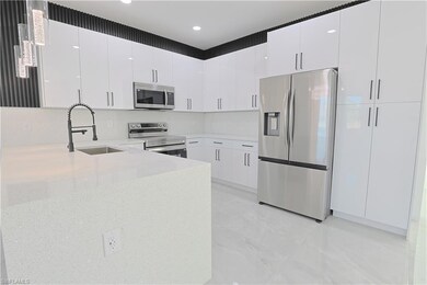 Kitchen with a sink, stainless steel appliances, a