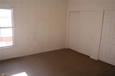 Unfurnished bedroom with baseboards