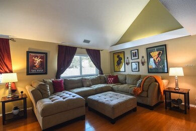 Vaulted ceilings along with wood laminate flooring