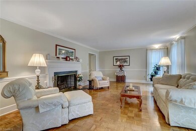 Living room with fireplace and wood floors