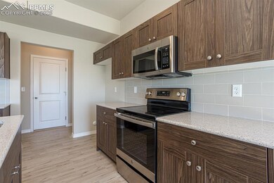 Kitchen featuring appliances with stainless steel 