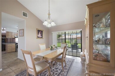 Dining room with access to kitchen and outdoor cov