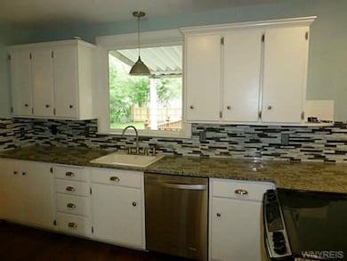 Kitchen. Built-in dishwasher and stove.