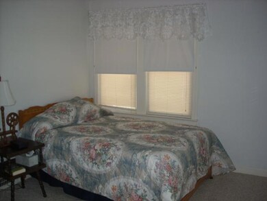 Master bedroom is light and airy with eastern morn