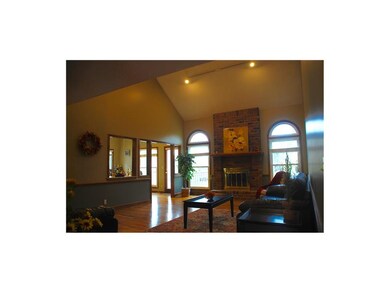Hardwoods in spacious Great Room with cozy firepla