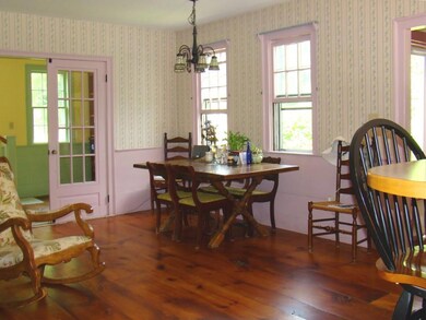 Dining room with gorgeous wide board...