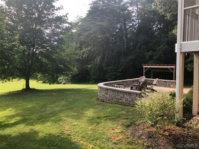 Newly built woodshed in background. Firepit does n