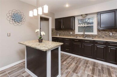 New light fixtures, backsplash & espresso cabinets