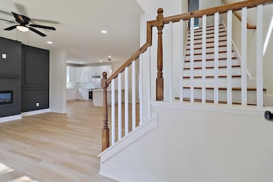 As you enter this home, the foyer is flanked by the stairway leading upstairs and the grand living room.