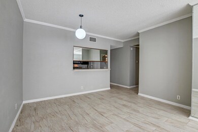 Empty room with baseboards, visible vents, and cr