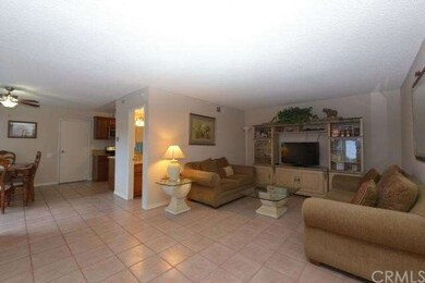 View of Living Room & Dining Room From The Entranc