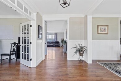 Hand finished oak floors and custom molding.