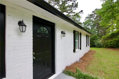 Property entrance featuring a lawn