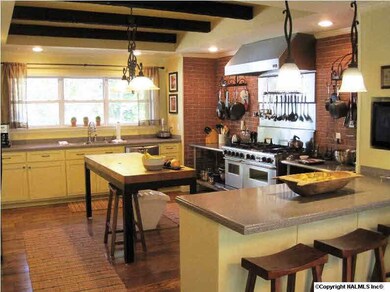 Kitchen view 2 showing the stainless steel gas stove and oven.