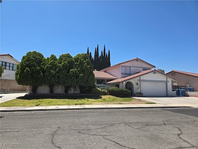 View of front of house with an attached garage, a