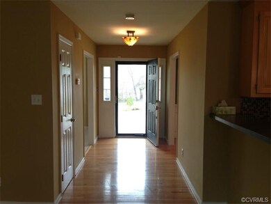 Elegant entry...side lights by front door!  Wood f