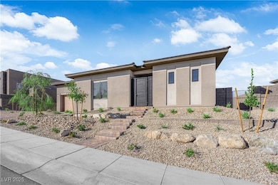 Prairie-style home featuring stucco siding and a garage