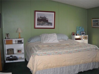 Master bedroom with bathroom just to...